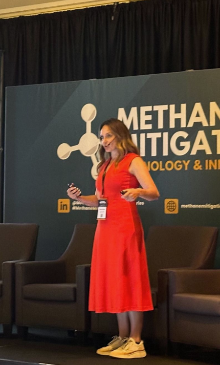 Jenna presenting on stage about demand creation